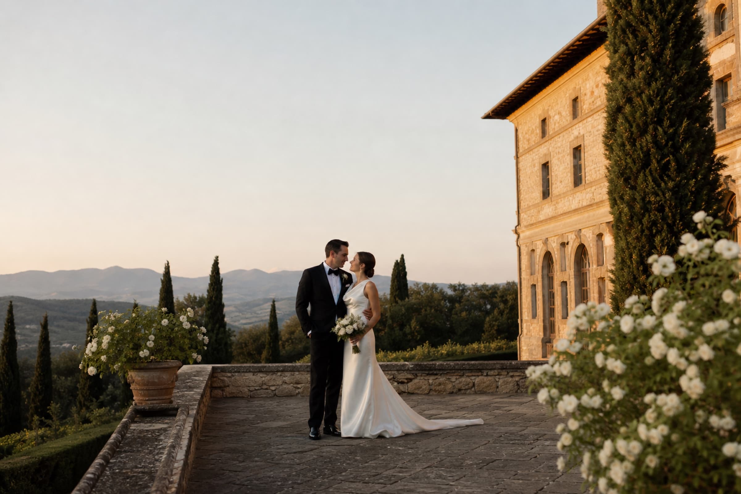 Newlyweds at a Tuscan villa at sunset